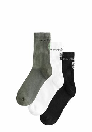 Three pairs of ribbed socks in olive green, white, and black. Each has a round toe and the phrase "never ful" stitched on the cuff.