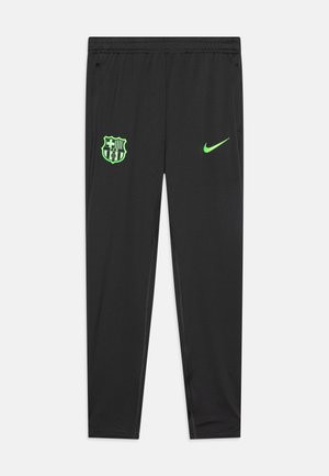 Schwarze Sporthose mit grünem Nike-Logo und FC Barcelona-Wappen. Hergestellt aus leichtem Stoff, mit tailliertem Schnitt und Seitentaschen.