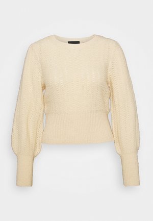 Stickad tröja - beige