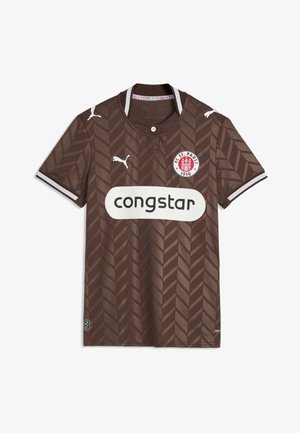 Brązowa koszulka piłkarska FC St. Pauli z wzorem w jodełkę, białymi logo Puma na klatce piersiowej i rękawach oraz białą etykietą sponsora Congstar z przodu.