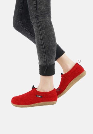 Red wool slip-on shoes with a textured upper, black accents, and tan rubber sole. Shoes feature adjustable drawstring for a snug fit.