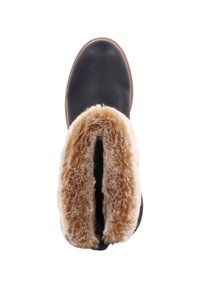 Bota de cuero negra con un suave forro de piel sintética color beige alrededor de la parte superior, con forma redondeada y textura lisa. Suela de goma para mayor agarre.