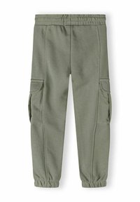 Groene katoenen cargobroek met elastische tailleband, taps toelopende manchetten en zijzakken. Zachte textuur, casual ontwerp, geschikt voor verschillende activiteiten.