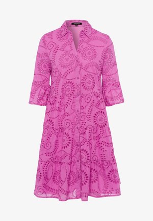 Pink tiered dress with a shirt collar, button front, and 3/4 sleeves. Features cut-out floral embroidery and a lightweight, textured fabric.