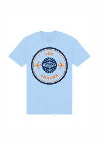 T-shirt di cotone azzurro chiaro con grafica circolare che presenta "JET LEADER" e "PAN AM", arricchita da due silhouette di aerei e cerchi concentrici.