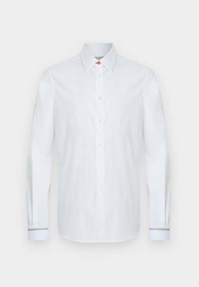 Άσπρο μακρυμάνικο πουκάμισο από βαμβάκι, με κλασικό γιακά, μπροστινά κουμπιά και ριγωτές λεπτομέρειες στα μανίκια. Ομαλή υφή.