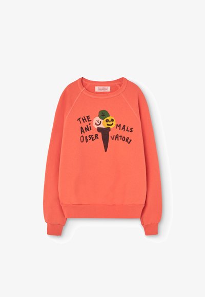 Coral sweatshirt featuring a playful ice cream cone graphic with smiling faces and text: "THE ANIMALS OBSERVATORY." Soft, textured fabric.