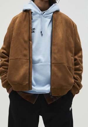Jacka i konstläder - brown