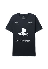 Maglietta nera in cotone con maniche corte. Presenta il logo PlayStation bianco e la scritta "SINCE 1994" sul davanti. Tessuto liscio, design casual.