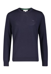 Navy blue knit sweater with a round neckline, ribbed cuffs, and hem. Features a small embroidered logo on the chest and a green inner collar.