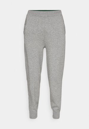 Gray tapered sweatpants with ribbed waistband and cuffs, featuring side pockets and a soft fabric texture.