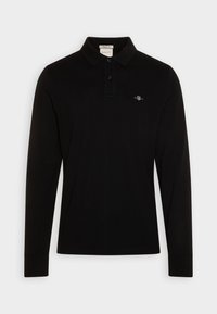 Schwarzes langärmliges Poloshirt aus Baumwolle mit einer Knopfleiste mit zwei Knöpfen und einem gestickten Logo auf der linken Brust.