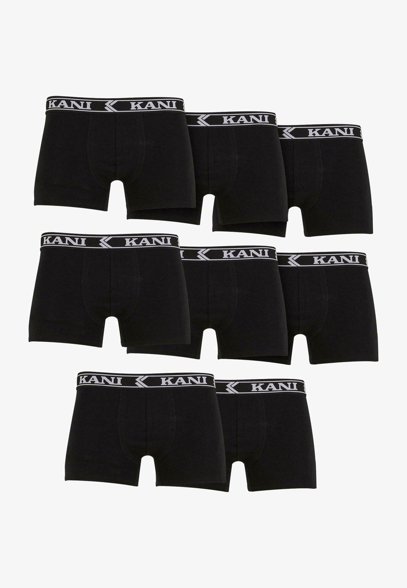 Černé bavlněné boxerky s bílým elastickým pásem s logem "KANI". Sedm kusů vystavených v různých orientacích.