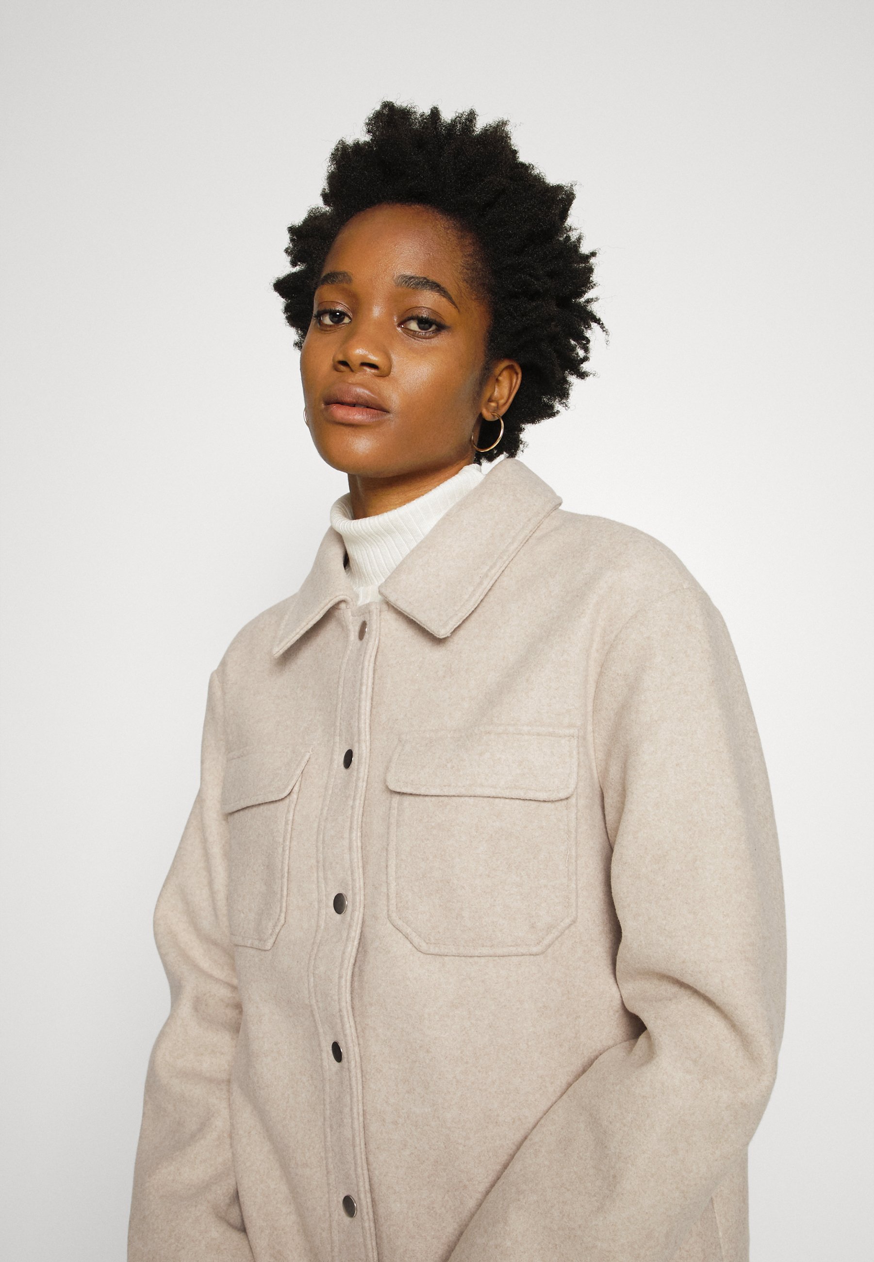 beige button coat