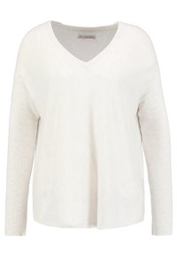 Ljust beige stickad tröja med v-ringning, ribbade långärmar och en texturerad yta. Har en avslappnad passform och öppen nederkant.