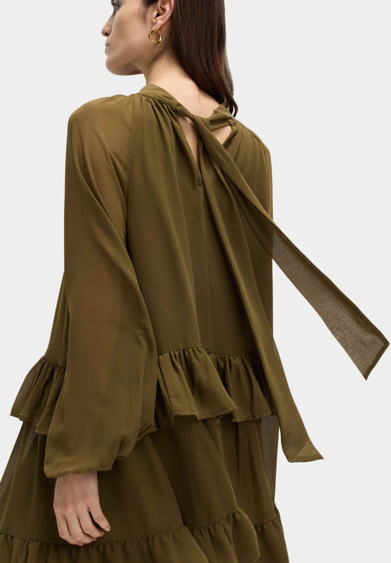 green dress marks and spencer Sienna Miller x M&S is back with sparkling partywear to dance in
