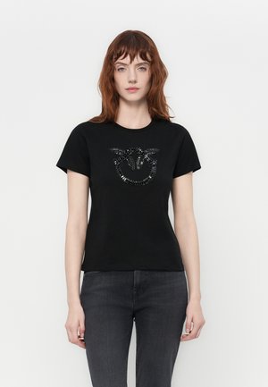 Black short-sleeved t-shirt made of cotton, featuring a shiny black bead-embellished graphic design on the front.