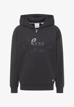 Črna zip-up kapuca iz mehkega materiala. Ima logotip natisnjen na sprednji strani, rebraste manšete in rob. Vključuje kapuco s vrvico.