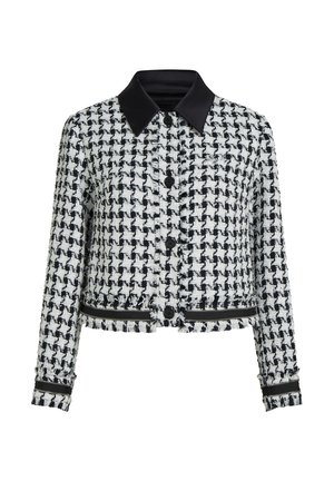 Veste texturée pied-de-poule noir et blanc avec boutons noirs, col en simili-cuir noir et détails à fermeture éclair aux poignets et à l'ourlet.