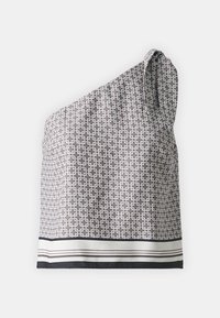 Asymmetriskt utanärmad topp i texturerad tyg, med ett geometriskt mönster i brunt och vitt, med en kontrasterande randig fåll.