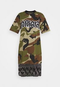 Camo-patterned dress with short sleeves, featuring a black lace hem. Material is soft fabric, displaying a mix of greens and browns.