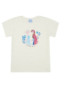 T-shirt crema con una grafica stampata di due personaggi che si tengono per mano, circondati da foglie blu e il testo "CREDO IN NOI."