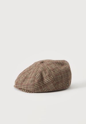 Καπέλο flat cap καρό σε καφέ και μπεζ χρώμα με μικρό υφασμάτινο κουμπί στην κορυφή, τοποθετημένο σε απλό λευκό φόντο.
