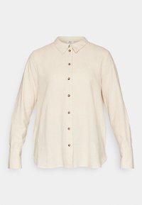 Cream-colored linen shirt with a button-down front, featuring a classic collar and long sleeves, accented with bronze buttons.