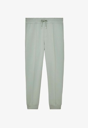 Lysegrå joggingbukser med elastisk talje, snørrejustering, sidelommer og ribkanter ved benenderne. Fremstillet af blødt, glat stof.