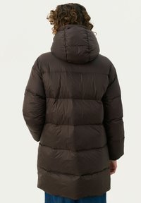 Brown puffer jacket with a hood, featuring a quilted design and a long silhouette. Smooth texture with visible seams and puffs.