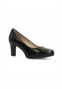 Escarpin noir en cuir, à bout arrondi, avec une texture lisse, un talon de hauteur modérée et des détails de couture subtils le long du bord.
