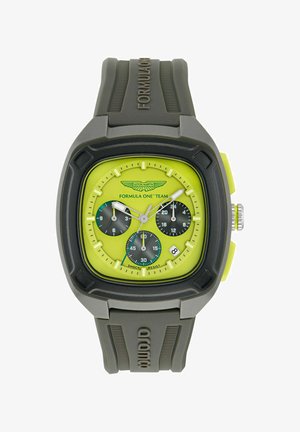 Aston Martin Formula One kell, millel on ruudukujuline hall korpus, erekollane kelladial, kolm musta aladialit ja hall kummirihm.