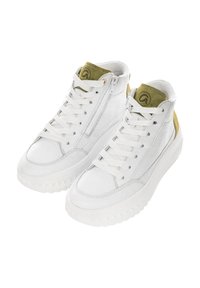 White high-top sneakers with thick textured soles, white laces, side zippers, and olive green tongue and heel accents with a logo.