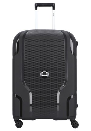 Hard-shell black suitcase with a textured, perforated surface, silver telescopic handle, and four black wheels for mobility.