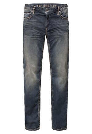 Donkerblauwe denim jeans met vervaagde gebieden en contrasterende stiksels. Beschikt over een klassiek vijf-pocket ontwerp en metalen accenten in de taille.