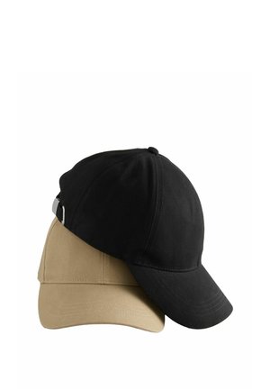 Two baseball caps stacked. The top cap is black; the bottom is khaki. Both are made of fabric with curved brims and adjustable straps.