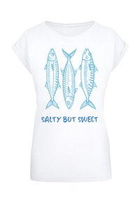 White t-shirt featuring three blue illustrated fish above the text "SALTY BUT SWEET" in a matching blue font. Soft fabric with rolled sleeves.