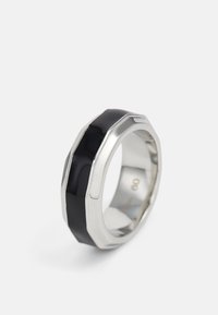 Silver ring with a faceted edge, featuring a central black inlay and a polished finish. Size markings visible on the inner band.