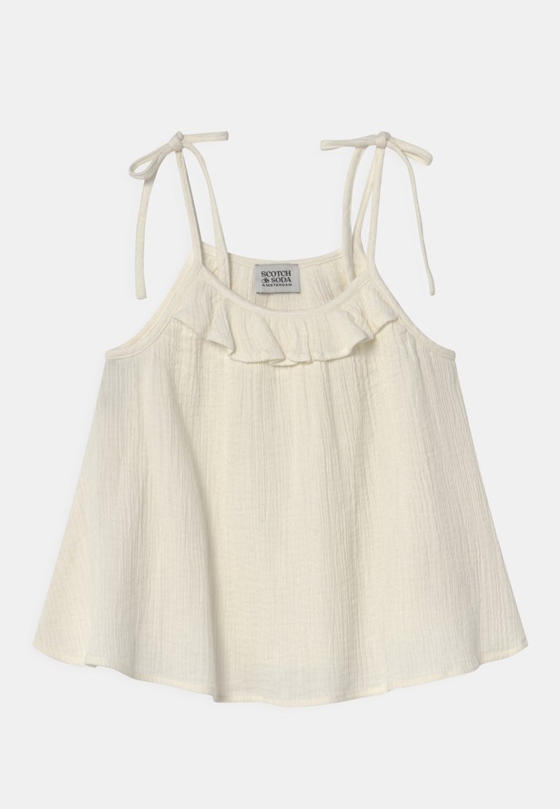 Top sin mangas de color crema claro con tirantes ajustables, escote con volantes y tejido texturizado. Diseño casual y fluido.
