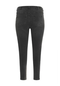Jeans oscuros de diseño ajustado, con cinco bolsillos, una cinturilla y costuras elegantes. Textura suave con un mínimo de detalles.