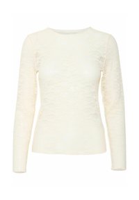 Haut à manches longues en dentelle blanche, avec un col rond et une silhouette ajustée, doté d'un motif floral en relief sur l'ensemble.