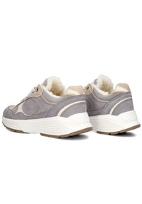 Grey suede sneakers feature a plush lining, beige accents, rounded shape, with a thick white midsole and textured rubber outsole.