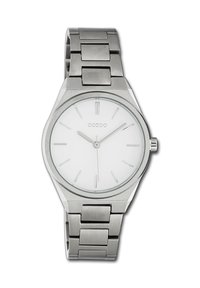 Montre en acier inoxydable argenté avec un cadran rond blanc, des index horaires minimalistes et un bracelet en métal composé de petites maillons rectangulaires.