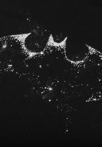 Black t-shirt featuring a white, starry pattern forming a bat symbol, with varying sizes of stars and a smooth, textured fabric.