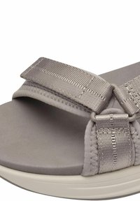 Grey sandal featuring soft, textured straps with woven detailing, a cushioned footbed, and a lightweight white sole.