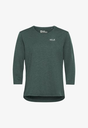Chemise à manches longues de couleur vert foncé avec un col rond, présentant un logo discret sur la poitrine gauche et un ourlet légèrement incurvé en bas.
