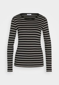 Camicia a maniche lunghe a righe bianche e nere realizzata in tessuto morbido, con scollatura rotonda e design fitted.
