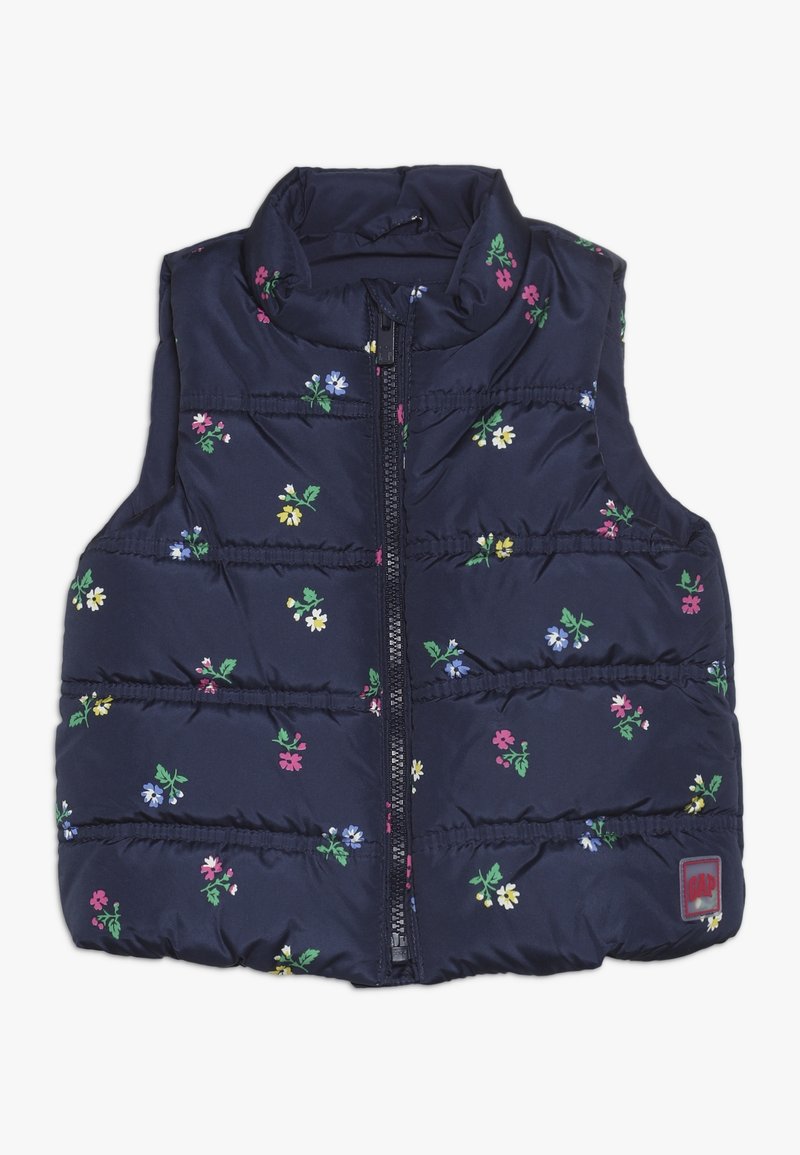 Gilet imbottito blu navy con piccoli motivi floreali in rosa, giallo, blu e bianco, dotato di zip frontale e colletto alto.