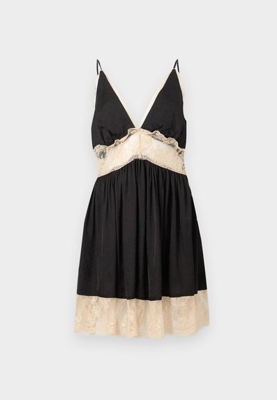 Μαύρο σατέν φόρεμα slip με μπεζ δαντέλα στο στήθος, τη μέση και το τελείωμα, με λεπτές τιράντες και V-λαιμόκοψη.