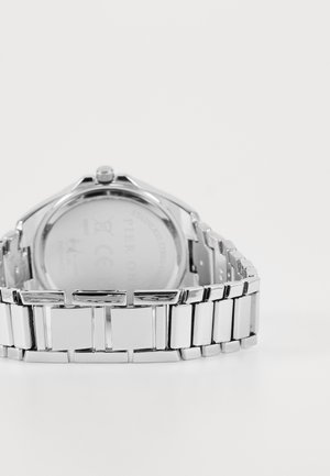 Roestvrijstalen horloge met een gepolijste zilveren afwerking, voorzien van een schakelarmband ontwerp. Ronde kast en een schone, minimalistische achterzijde.